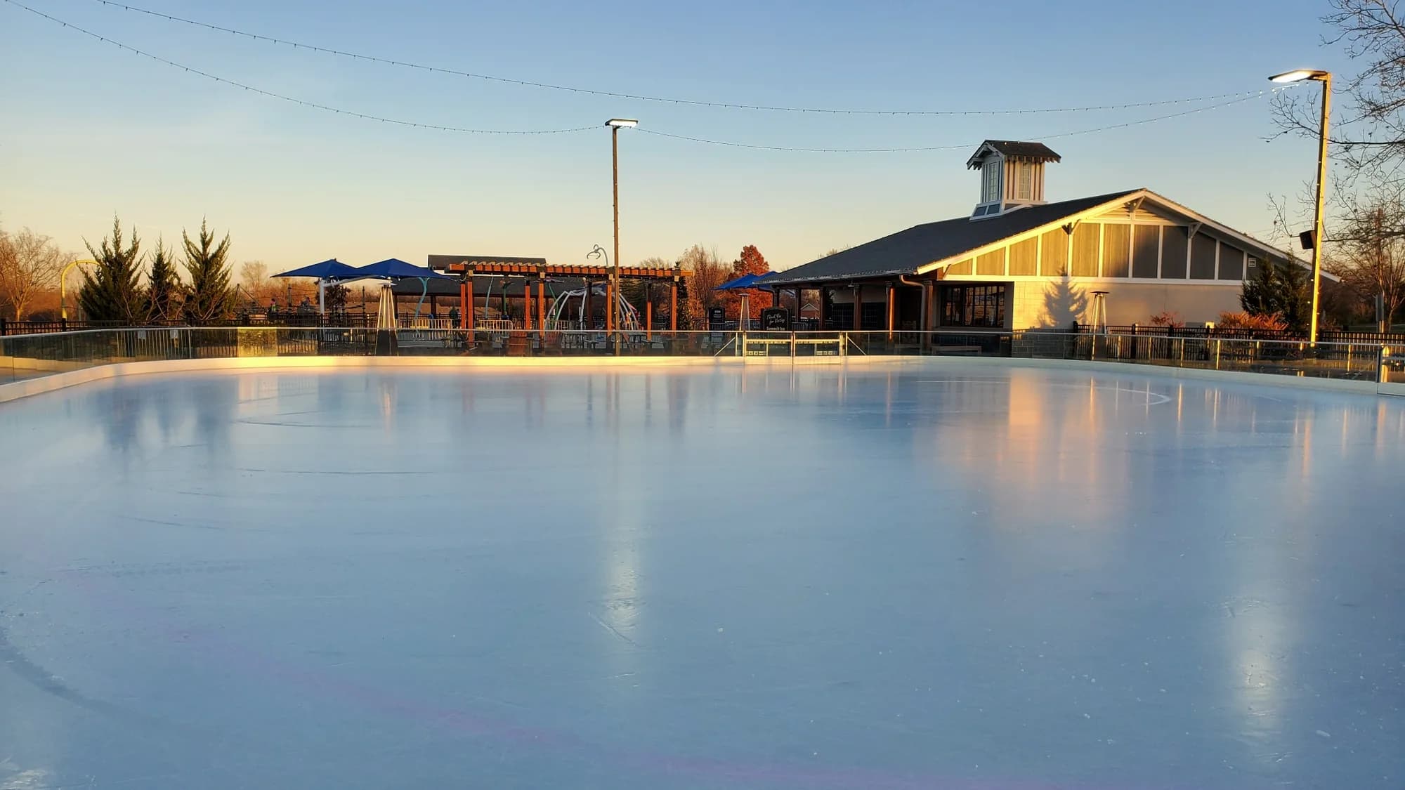 Clean outdoor rink ice following seasonal operating and protection practices