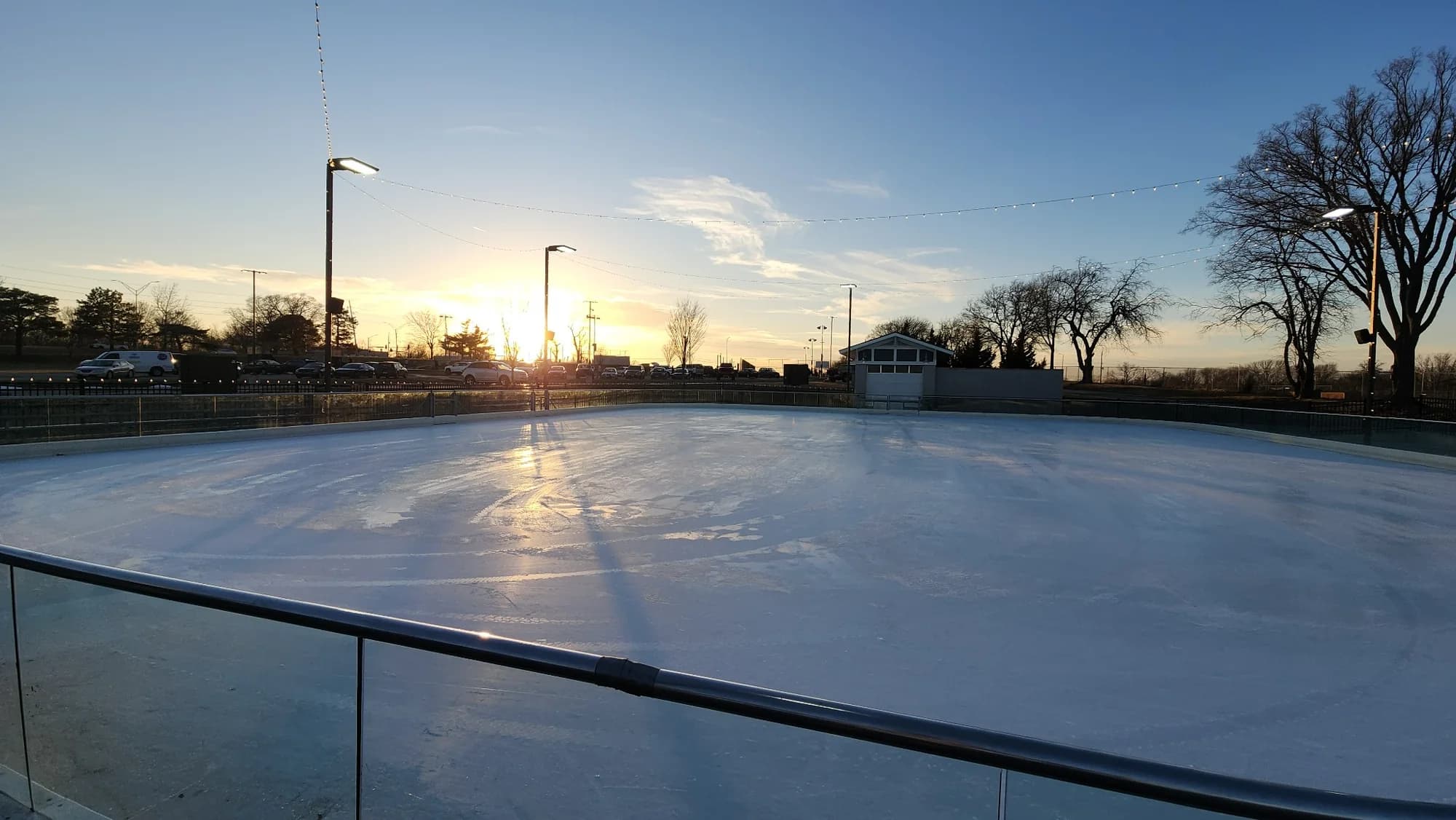 Outdoor rink with clean ice during sunrise
