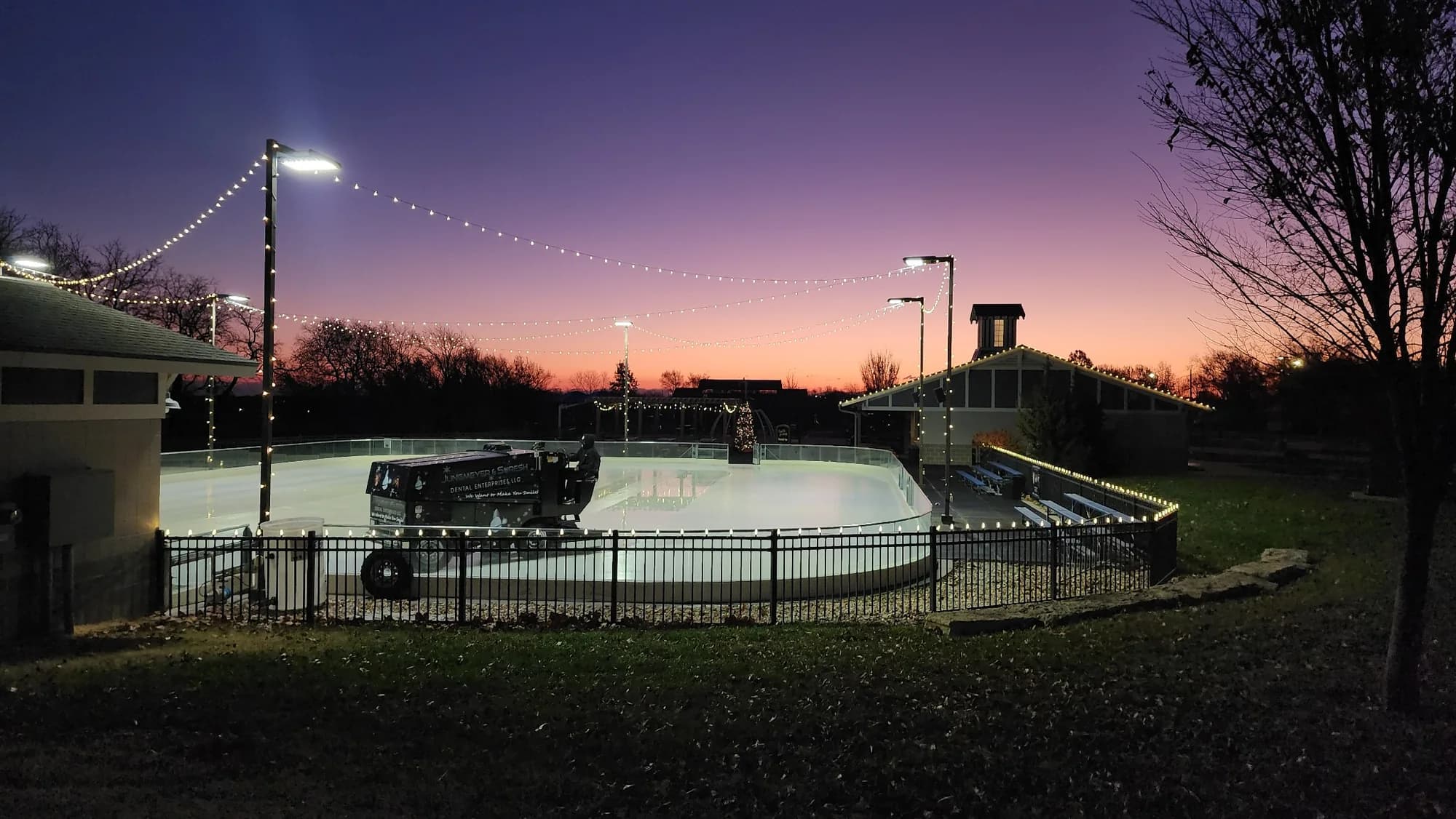 Outdoor rink with clean maintained ice at twilight